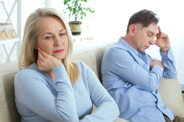 Middle aged couple in quarrel at home